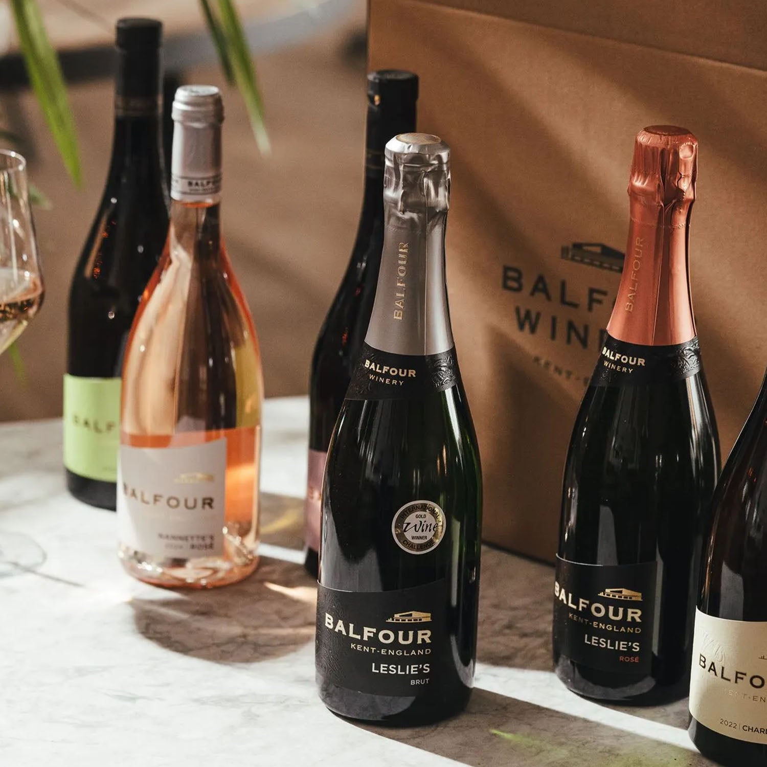 Collection of Balfour Winery bottles on a table with a branded bag in the background.