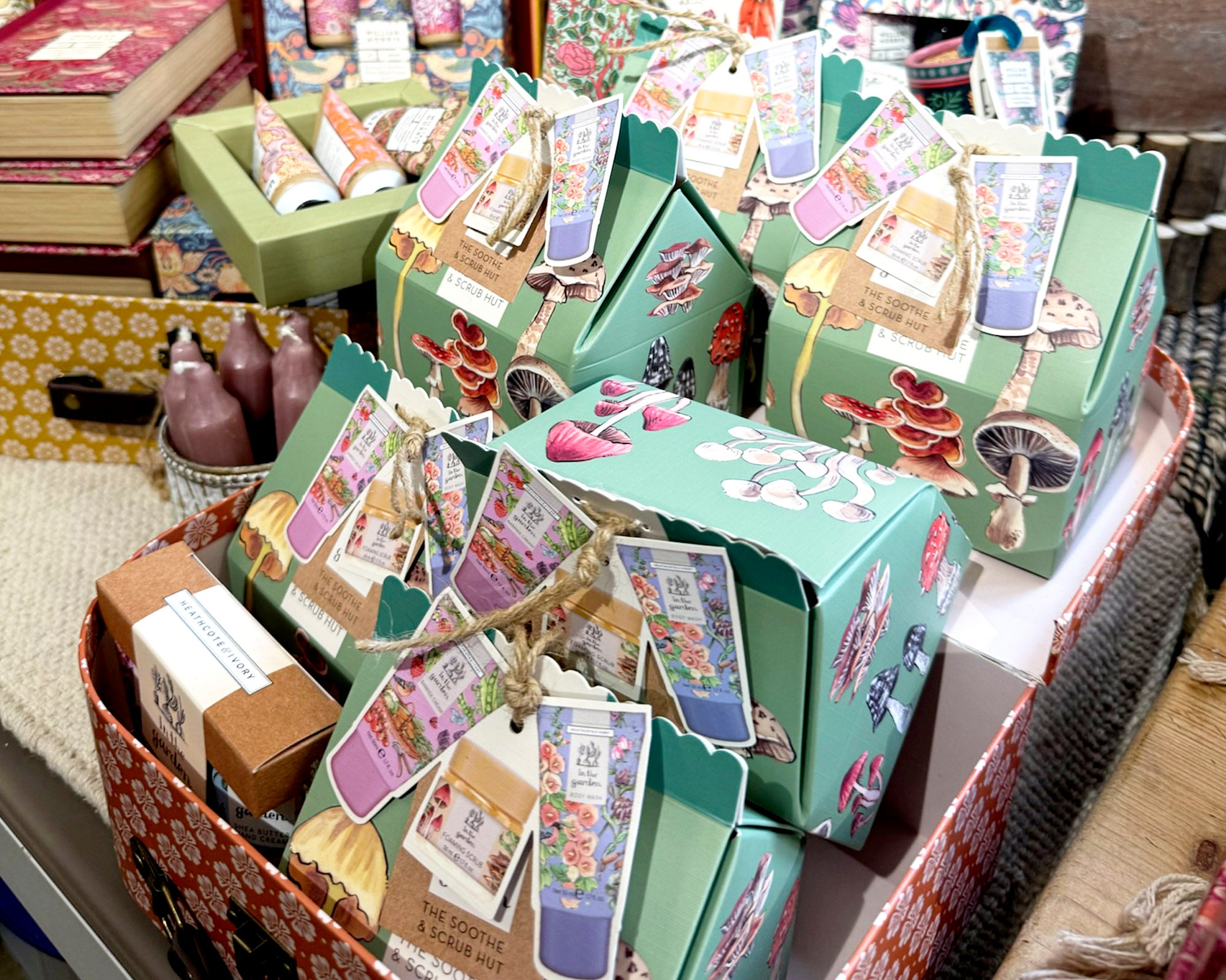 Decorative boxes with colorful labels and designs on a table.