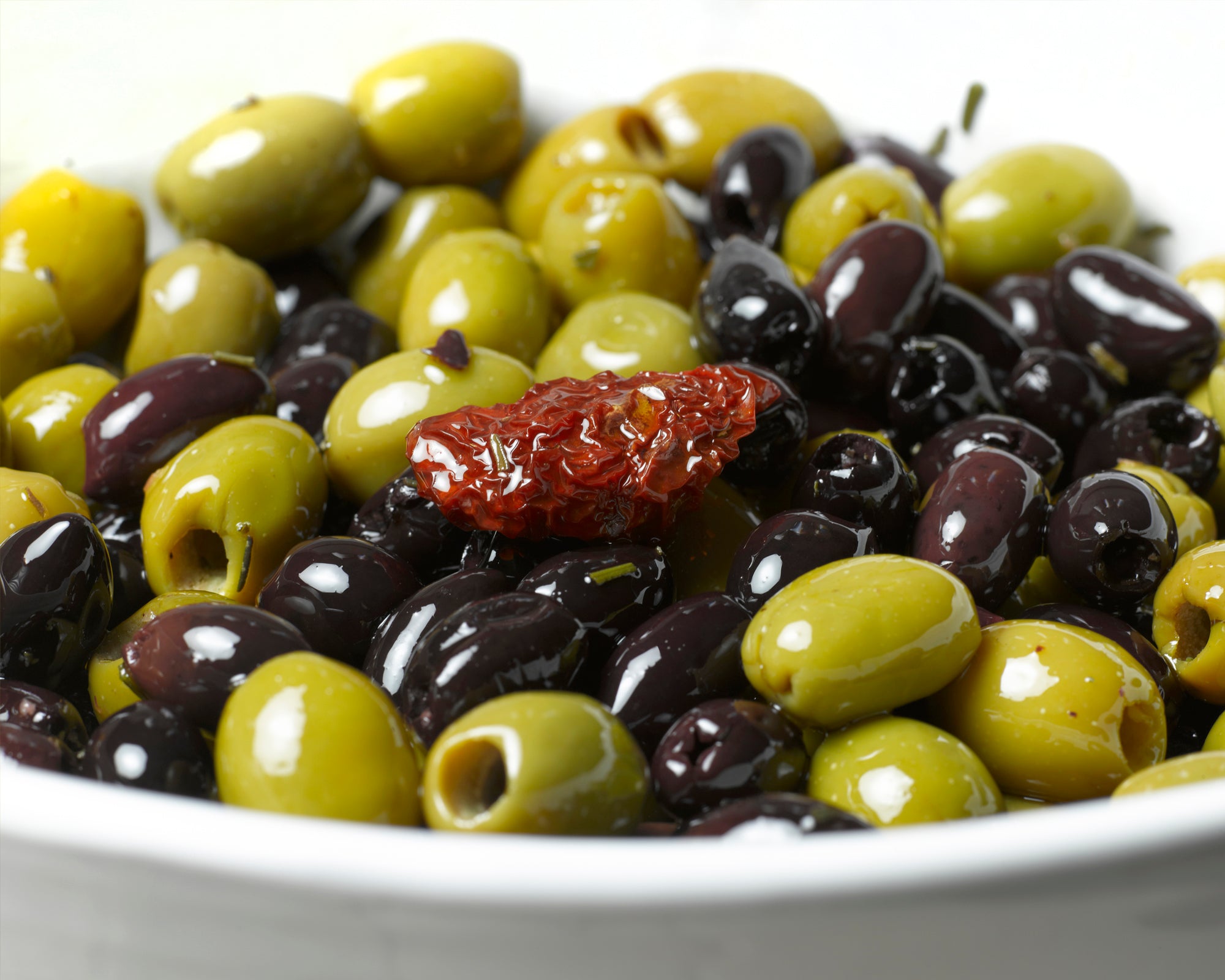 close up of mixed olives in a bowl